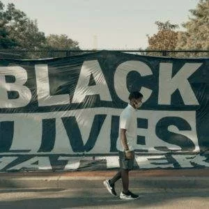 Black Lives Matter banner on a fence